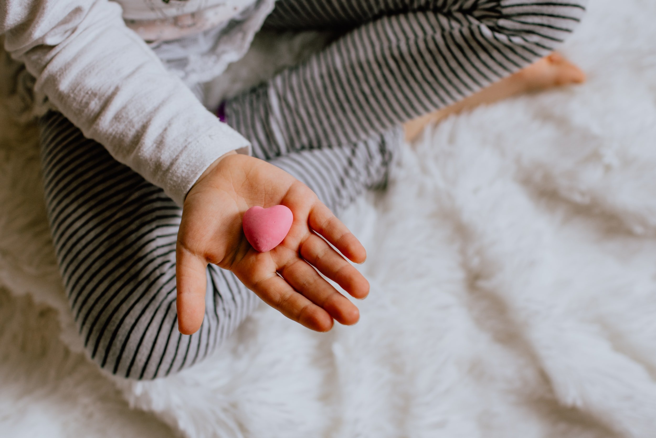 Child holding heart